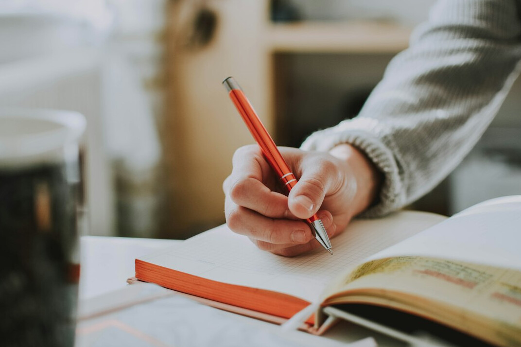 person journaling goals