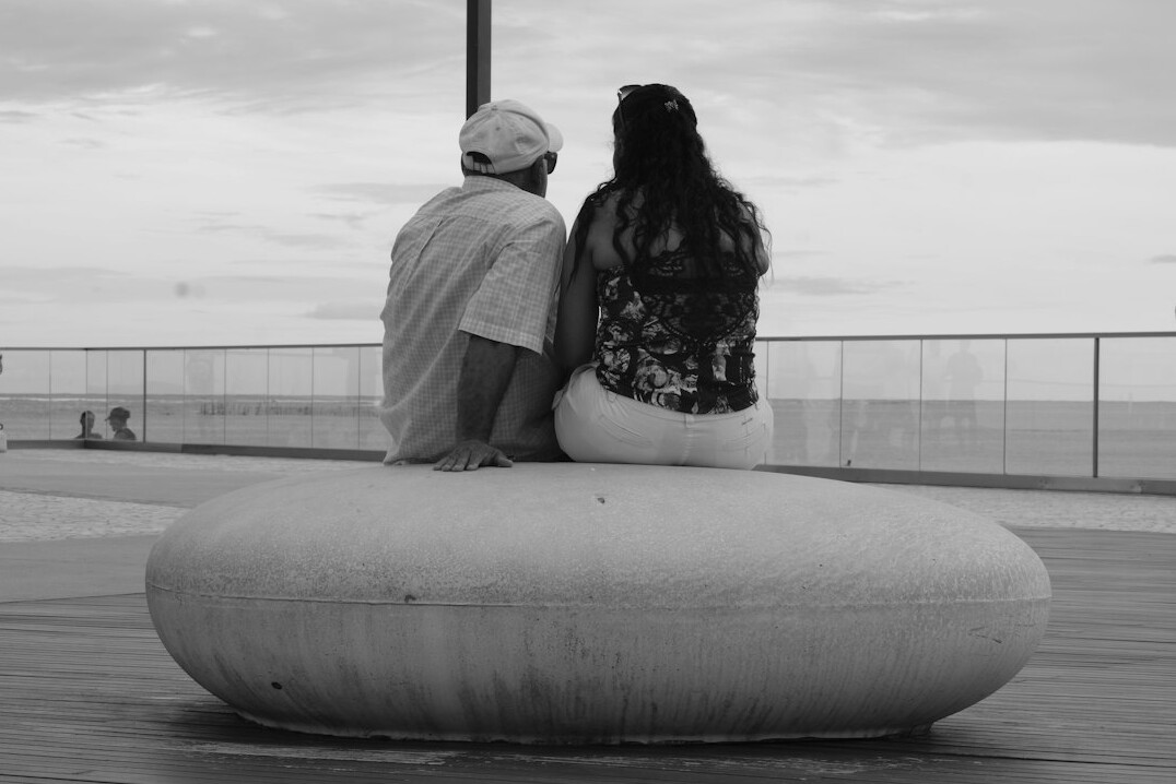 Brazilian man and woman having an attentive outdoor conversation